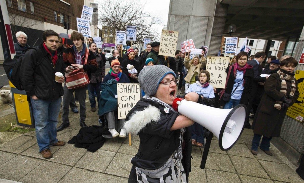 Tara Flood at Hammersmith Town Hall protesting with a loudspeaker